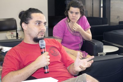 Participant of the audience makes questions to the exhibitors