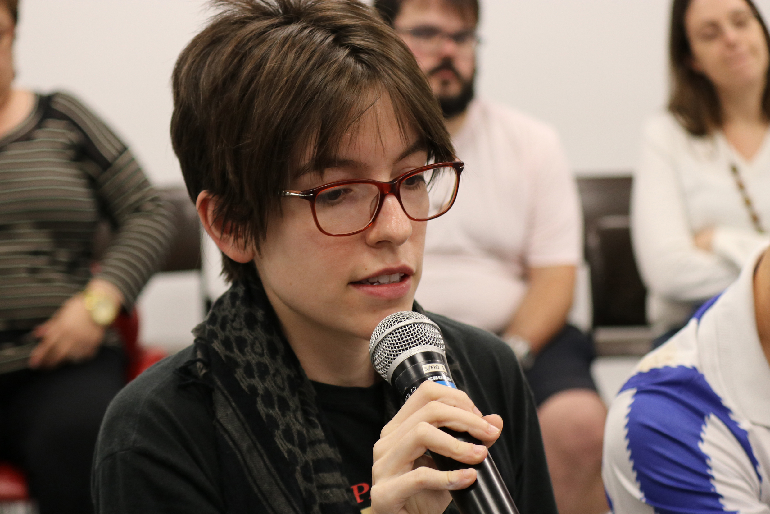 Participant of the audience asks a question