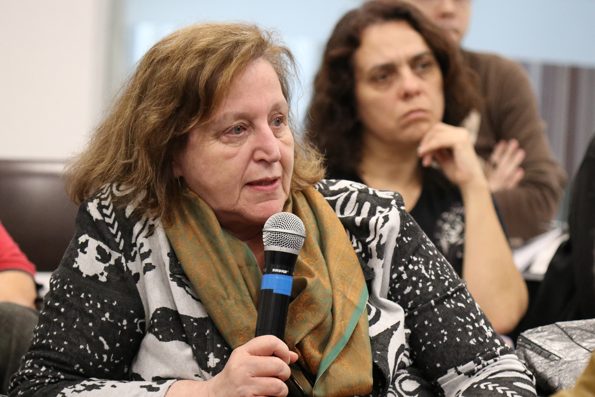 Regina Markus asks questions during the debate