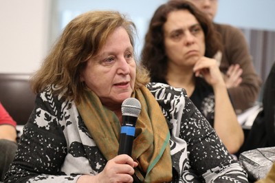 Regina Markus asks questions during the debate